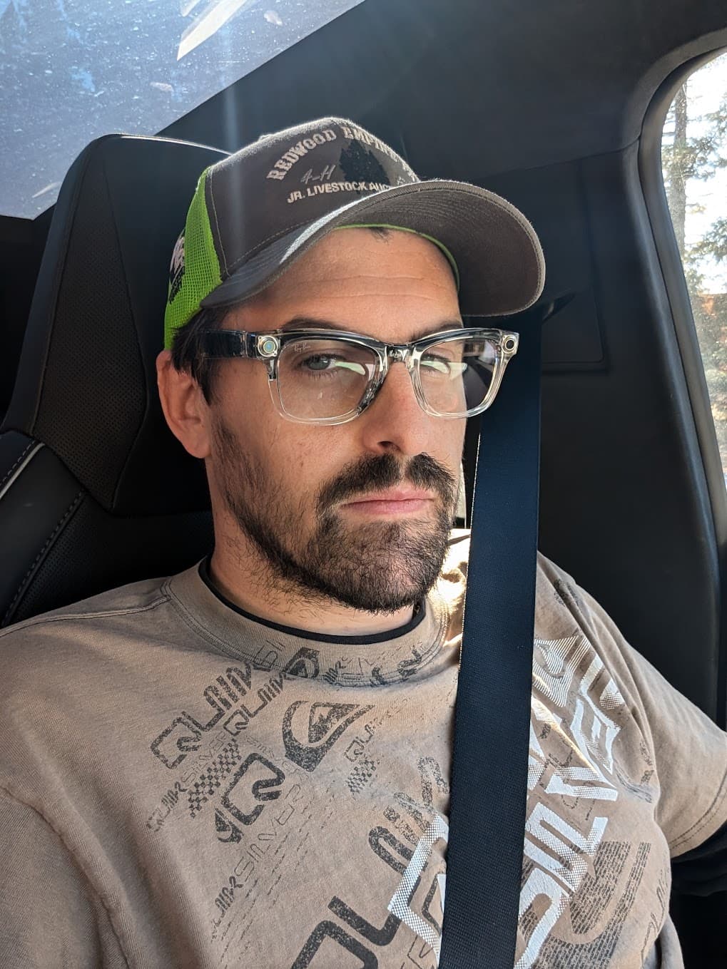 Russell Green wearing a hat and Ray-Bans